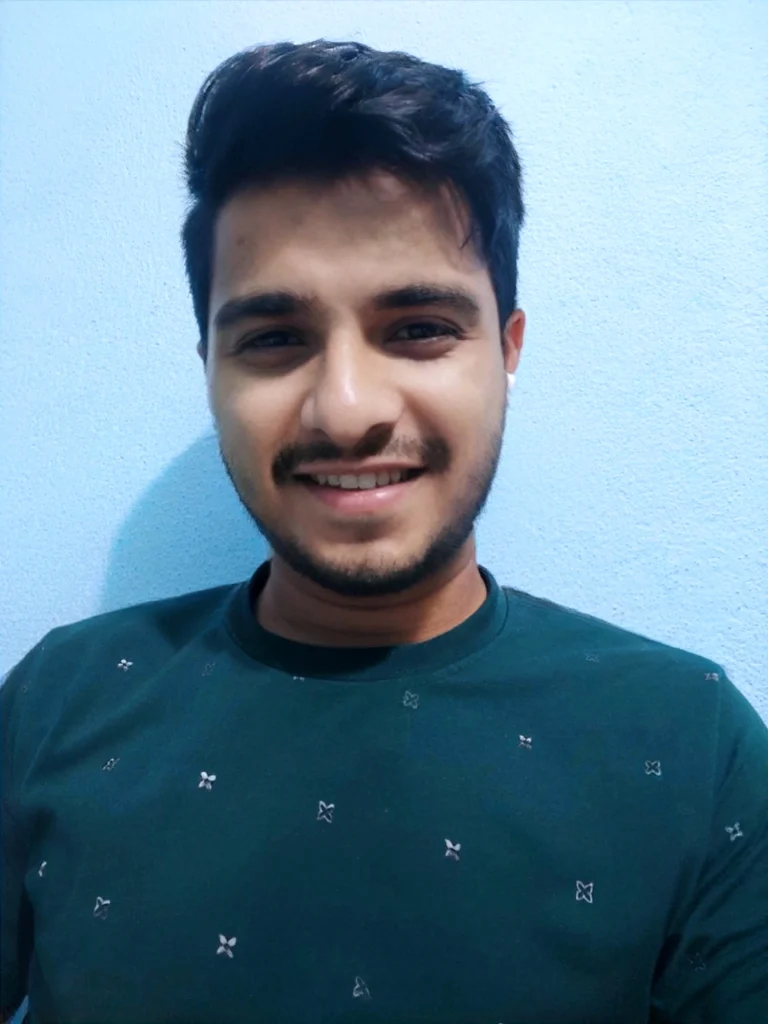Subhra Prakash Mohanty as AI Artz smiling in a teal urban t-shirt, original reference image for Google Gemini AI photo editing prompts, lifestyle and urban portrait edits, Men’s AI photoshoot ideas, AI Art Revolution, and Best of Trend website creator by AI Artz